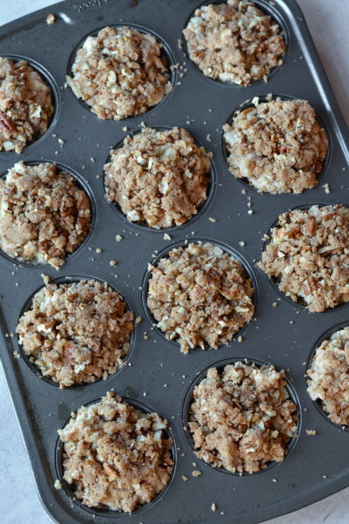 Apple Cinnamon Muffins full of chopped apples and cinnamon. Deliciously moist muffins that come together in a flash! Use up those extra apples and bake up these family favorites today!