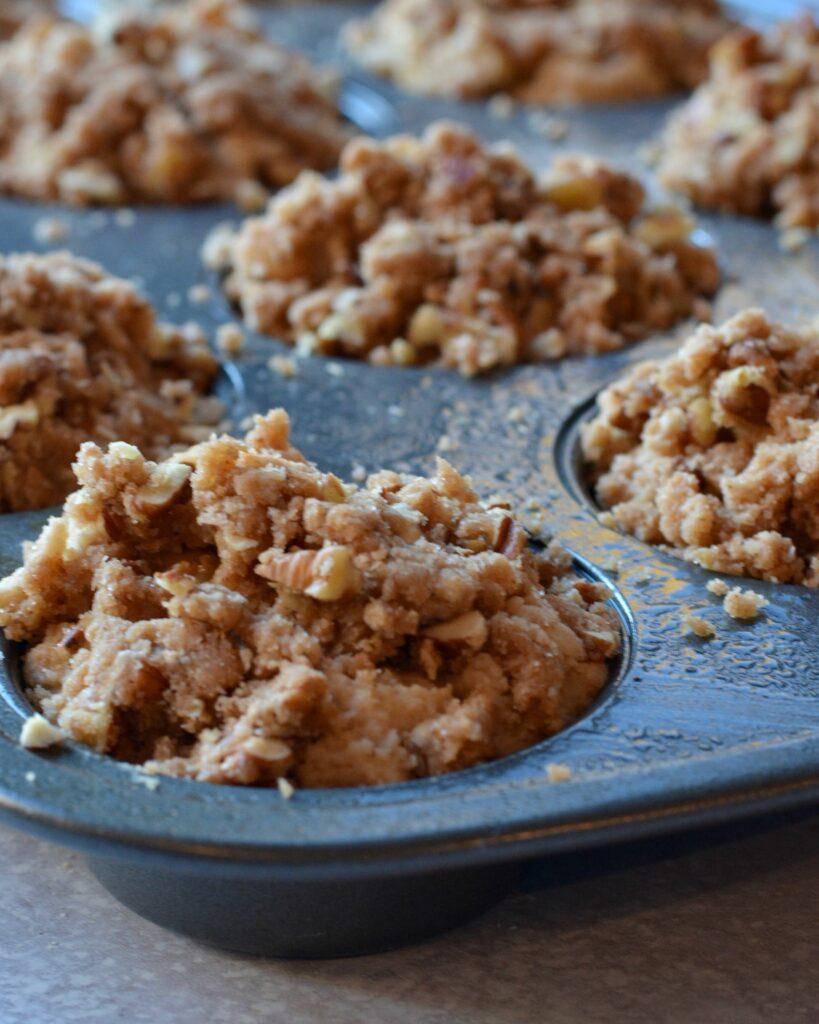 Apple Cinnamon Muffins full of chopped apples and cinnamon. Deliciously moist muffins that come together in a flash! Use up those extra apples and bake up these family favorites today!