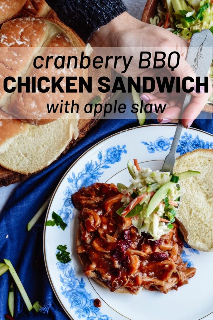 Cranberry BBQ Pulled Pork with Apple Slaw - slow cooker chicken thighs and make ahead slaw cuts dinner prep time to a minimum. Completely delicious meal the whole family will love! #cranberry #bbq #slowcooker #chickensandwich #makeaheadmeal