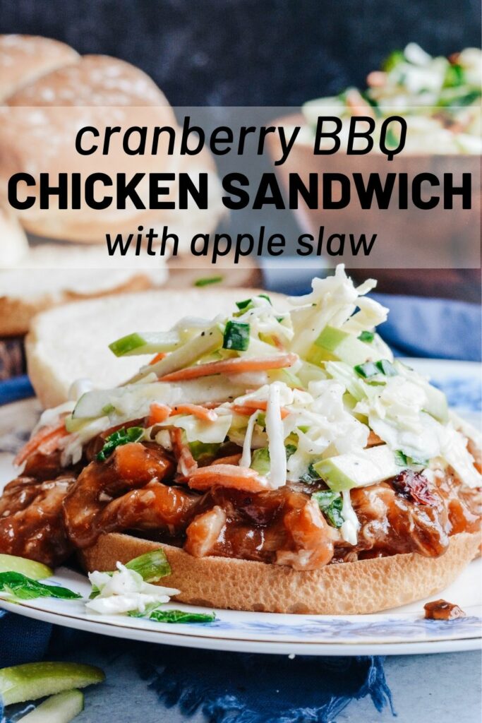 Cranberry BBQ Pulled Pork with Apple Slaw - slow cooker chicken thighs and make ahead slaw cuts dinner prep time to a minimum. Completely delicious meal the whole family will love! #cranberry #bbq #slowcooker #chickensandwich #makeaheadmeal