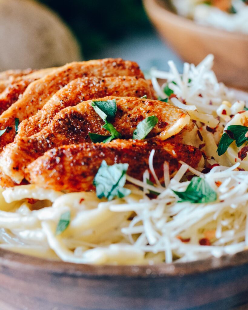 Blackened Chicken Alfredo | Simple recipe full of flavor. Creamy and spicy all at the same time. Great for date night. #blackenedchicken #alfredo #weeknightmeal