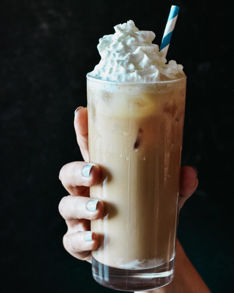 Iced White Chocolate Mocha Recipe | Starbucks Copycat. Easy to mix up for your favorite time to enjoy get your jolt. Only 2 ingredients for the sauce and lots of tips if you don't have an espresso machine. #starbuckscopycat #whitemocha #whitechocolate