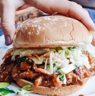 Cranberry BBQ Pulled Chicken with Apple Slaw - slow cooker chicken thighs and make ahead slaw cuts dinner prep time to a minimum. Completely delicious meal the whole family will love!