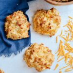 Cheddar Drop Biscuits absolutely loaded with cheese and flavor. Perfect companion to your favorite soup or alongside your BBQ. #biscuits #cheddarbiscuit #glutenfree