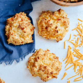 Cheddar Drop Biscuits absolutely loaded with cheese and flavor. Perfect companion to your favorite soup or alongside your BBQ. #biscuits #cheddarbiscuit #glutenfree