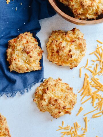 Cheddar Drop Biscuits absolutely loaded with cheese and flavor. Perfect companion to your favorite soup or alongside your BBQ. #biscuits #cheddarbiscuit #glutenfree