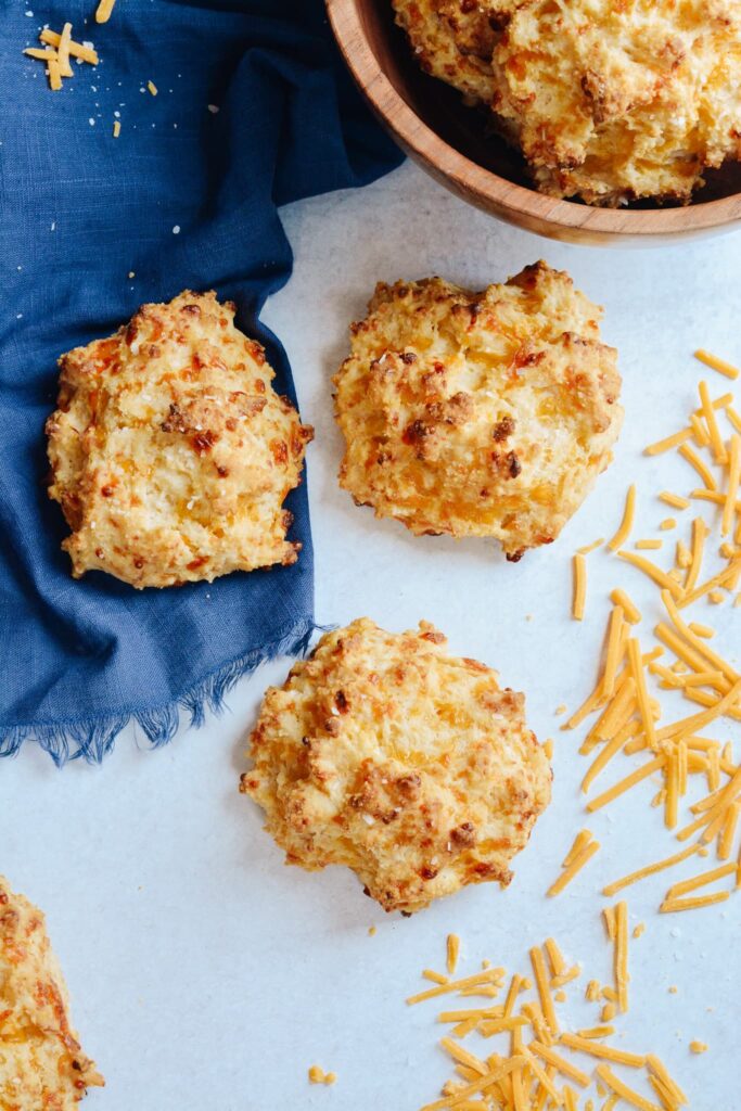 Cheddar Drop Biscuits absolutely loaded with cheese and flavor. Perfect companion to your favorite soup or alongside your BBQ. #biscuits #cheddarbiscuit #glutenfree