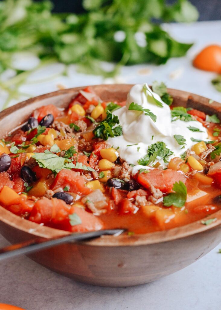 Taco Soup Recipe to warm your soul and your whole body. Perfectly balanced flavors, like a taco in a bowl! Enjoy with tortilla chips and cold weather. 