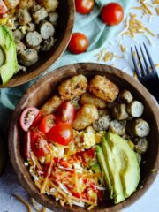 Simple Breakfast Hash—Perfect brunch hash, scrambled eggs, tater tots, cheese, avocado, sausage and toppings.