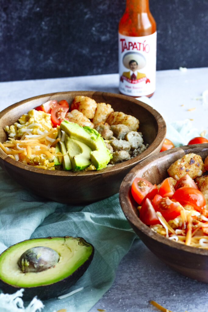 Simple Breakfast Hash—Perfect brunch hash, scrambled eggs, tater tots, cheese, avocado, sausage and toppings.