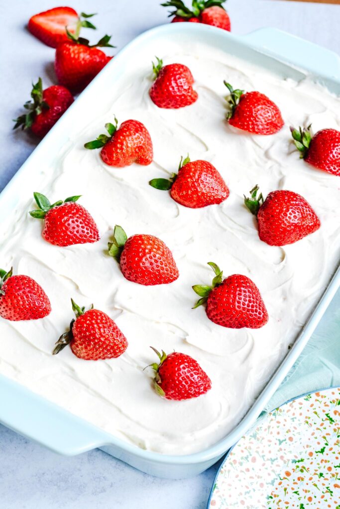 Gluten Free Strawberry Cake - Light, sweet and fluffy cake topped with cream cheese buttercream frosting. Perfect for summer holidays.