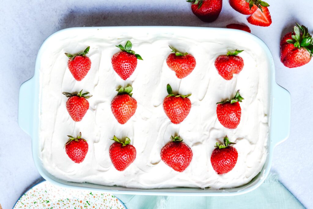 Gluten Free Strawberry Cake - Light, sweet and fluffy cake topped with cream cheese buttercream frosting. Perfect for summer holidays.