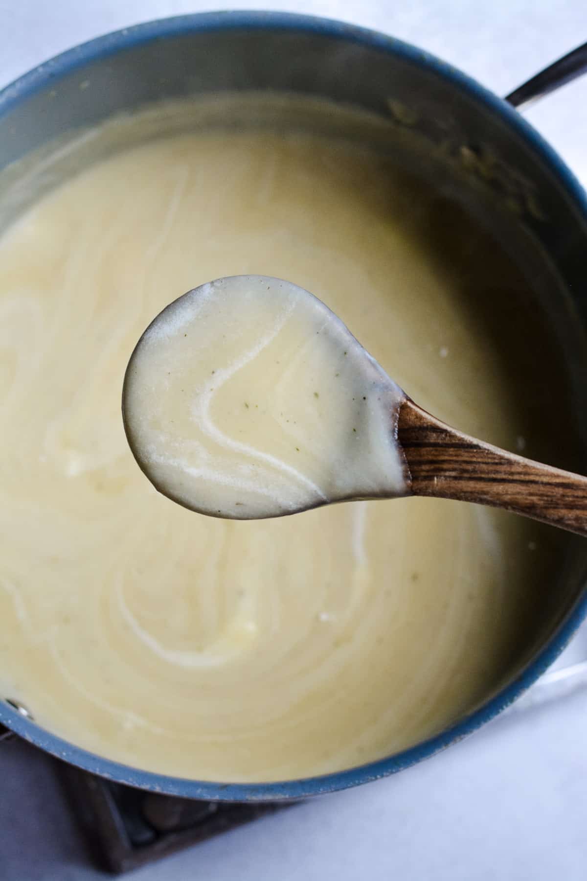 Stirring in sour cream and butter.