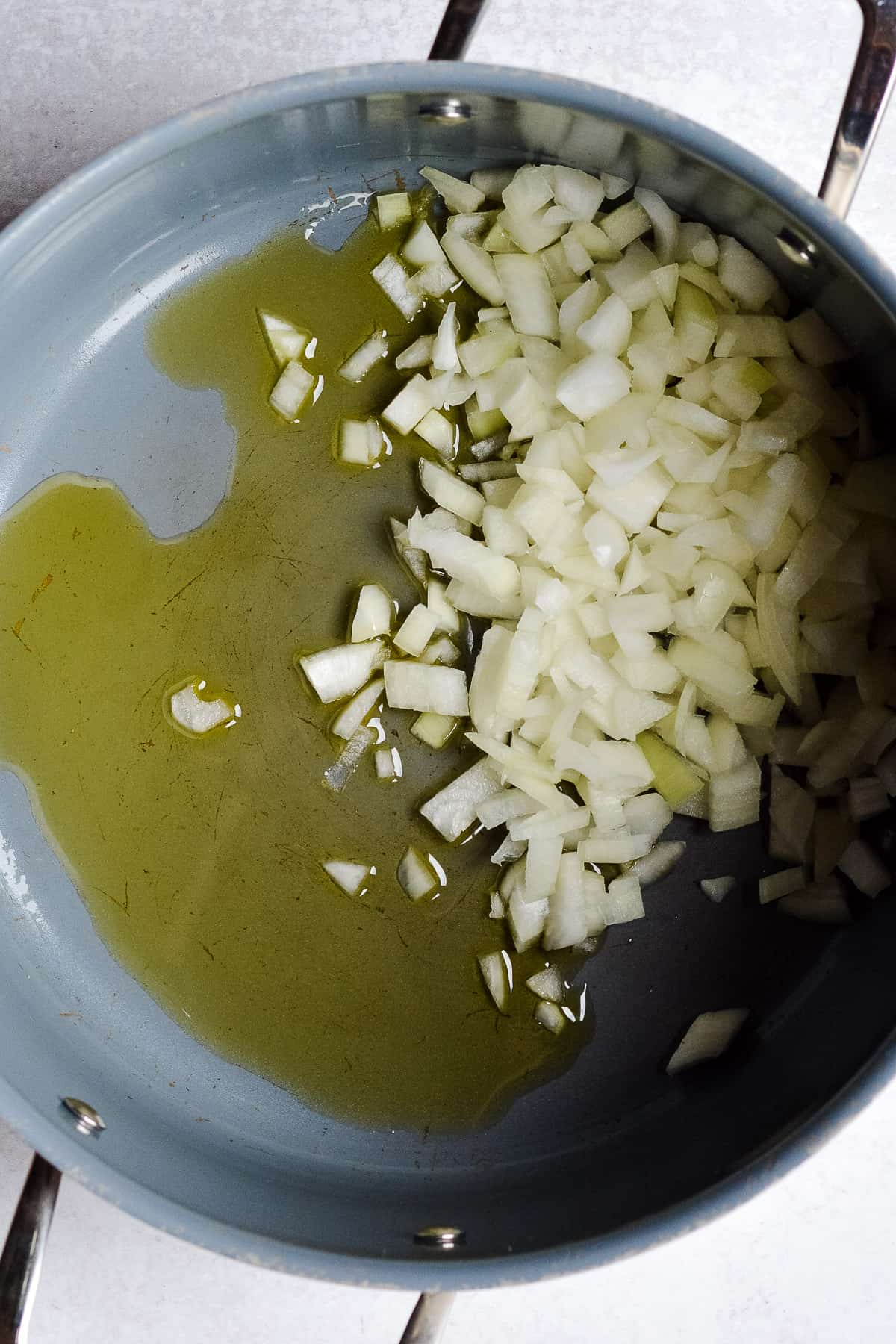 Chopped onions and olive oil in a large pot.