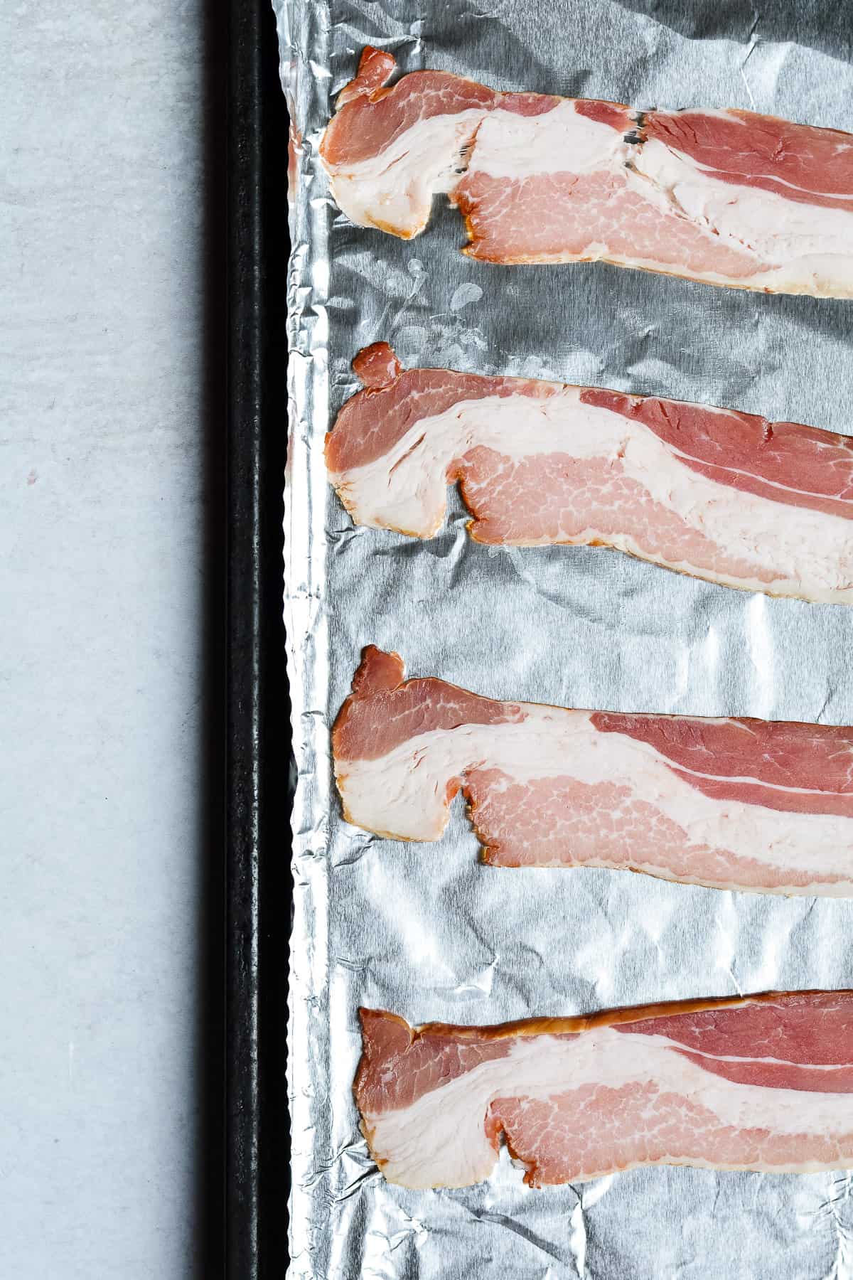 Bacon on a baking sheet with foil