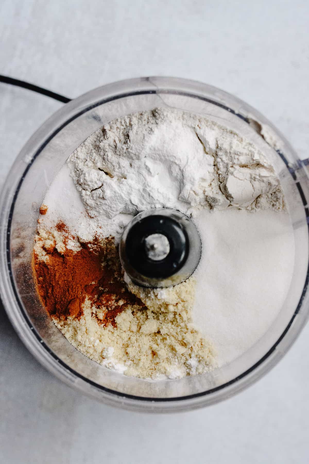 Dry ingredients in food processor.