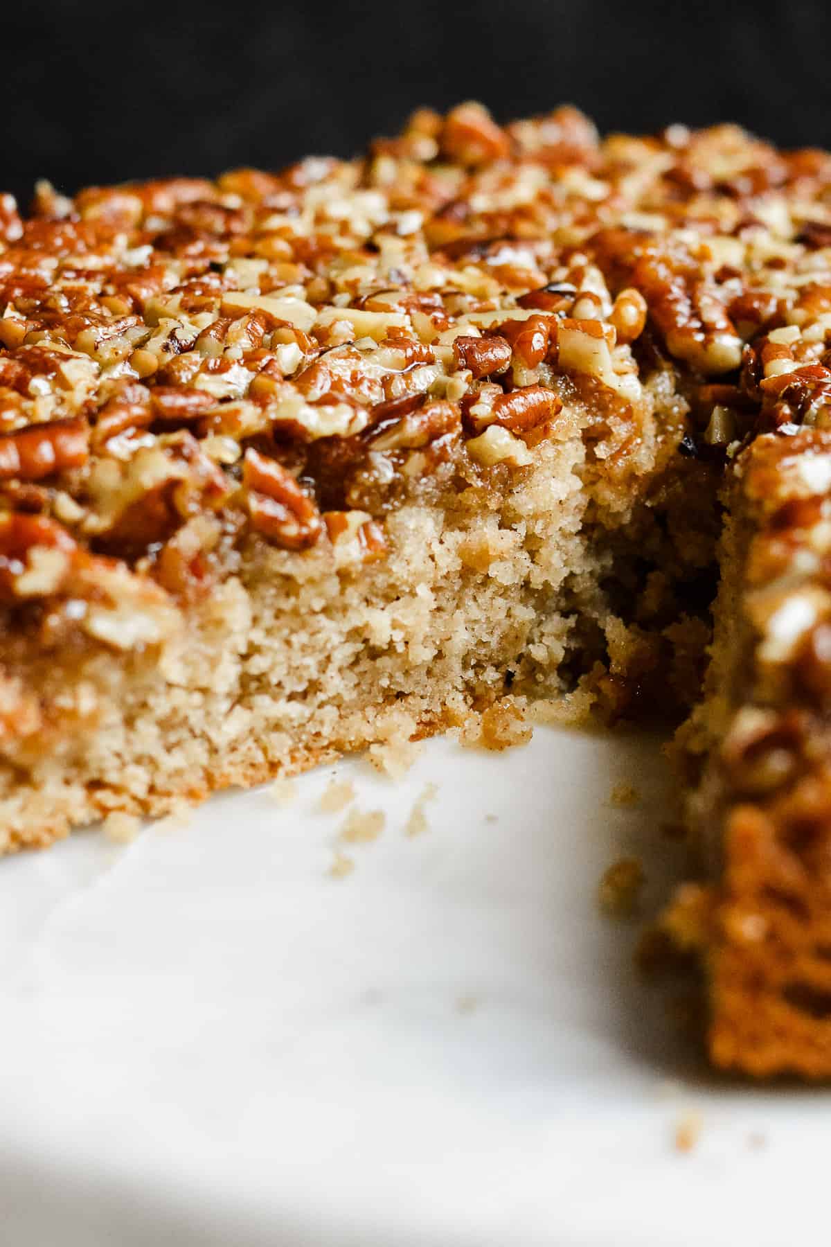 Inside of pecan cake on cake stand.