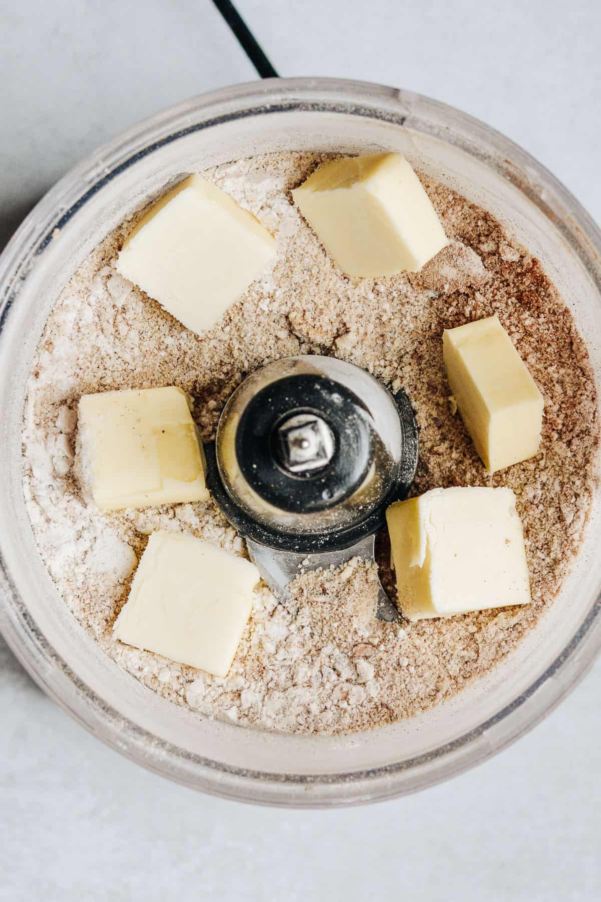 Butter pats on top of ground up crumb topping.