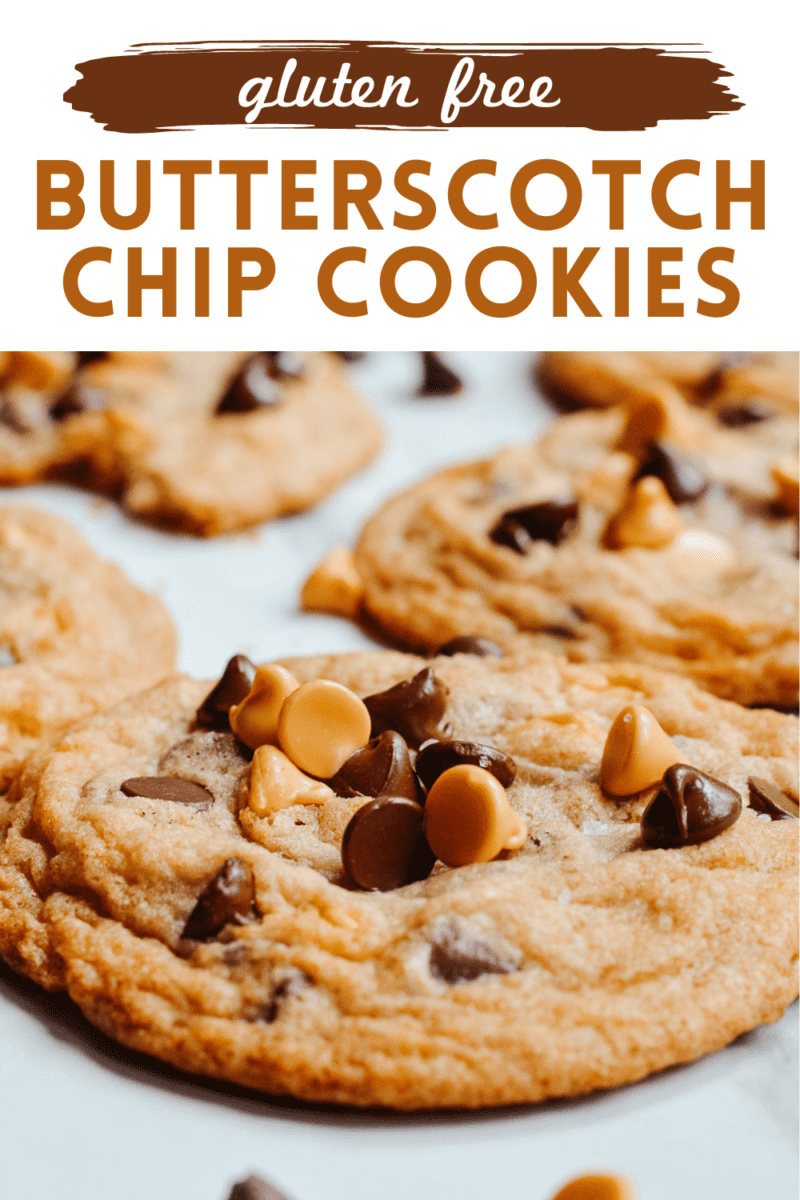 Close up of butterscotch and chocolate chips on top of cookies.